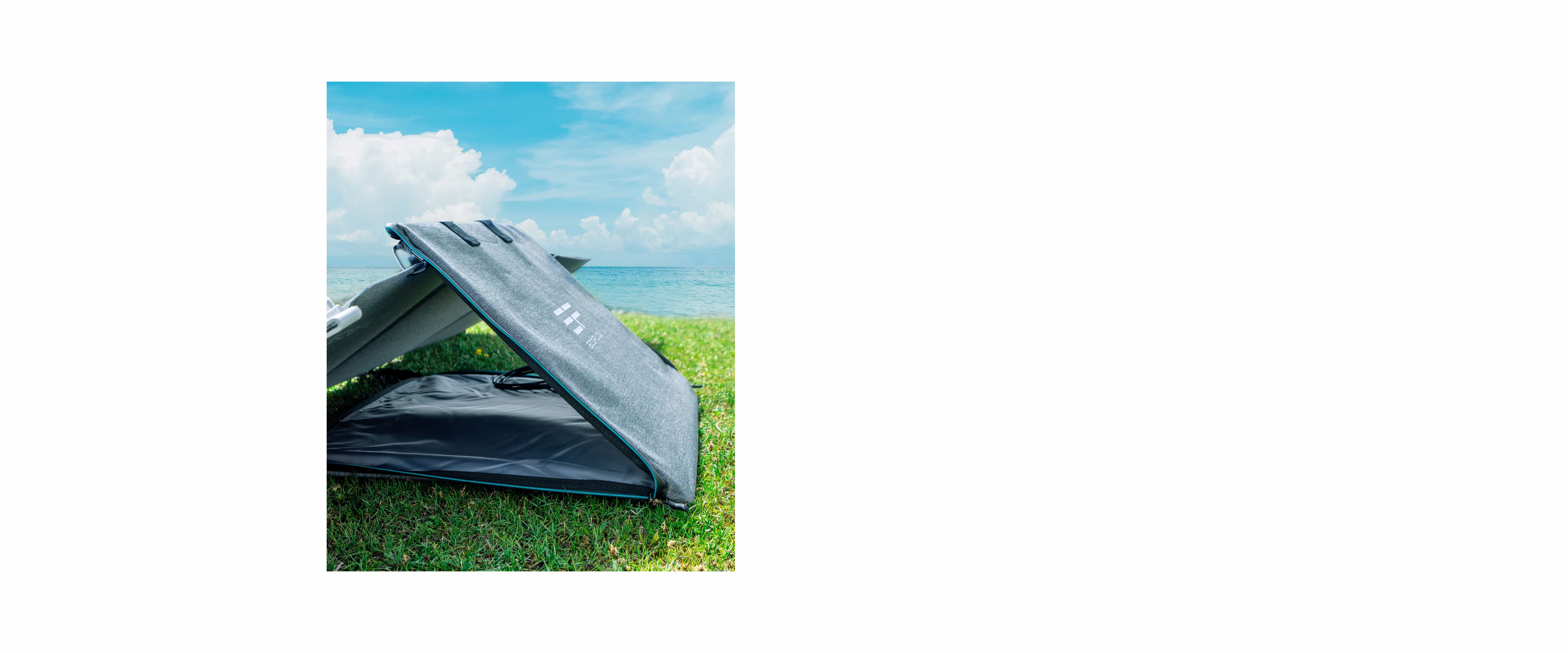 Black and white boat on green grass field under blue sky during daytime